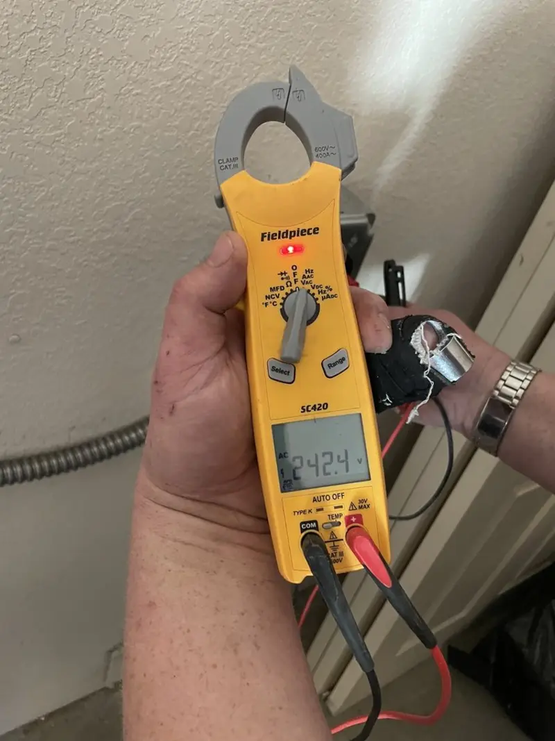 Voltage testing with clamp meter during Aluminum Wiring Replacement in St. Johns